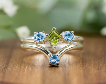 Handmade double band ring made from recycled 925 sterling silver with blue and green gemstones. Peridot & Topaz. Sustainable from Bali!