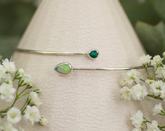 Filigree sterling silver bangle with gemstones - green emerald & Australian opal, birthstones of May and October. Luxury bridal jewelry.