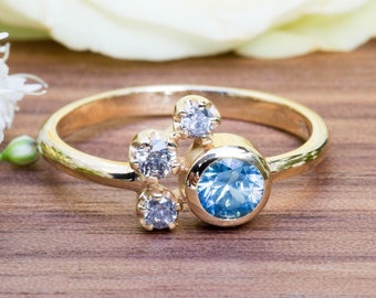 Handmade Ring in 18 carat eco gold with Blue Montana Sapphire and three Salt and Pepper Diamonds - perfect Engagement ring!