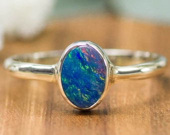 Handmade Opal ring in sterling silver with oval shaped gemstone ethical sourced engagement ring