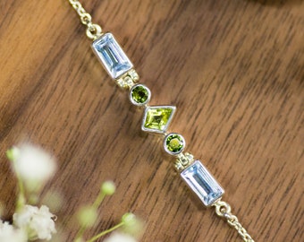 Handmade bracelet from recycled 925 sterling silver with blue and green gemstones. Peridot, tourmaline & topaz. Sustainable from Bali!