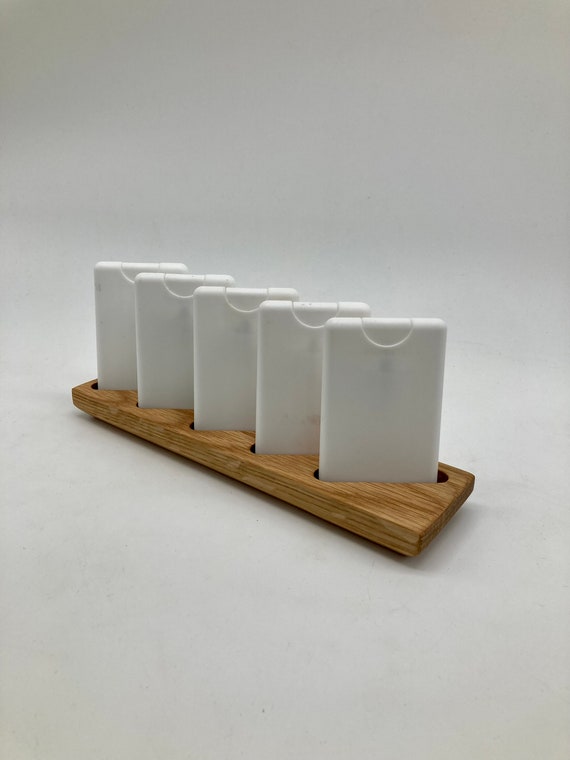 Custom-made display for storing items such as dietary supplements and sprays, made of beechwood.