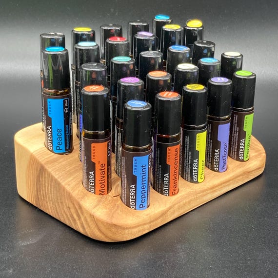 Beautiful, unique ash wood display stand for 27 oil roll-ons (10ml), suitable for e.g., doTERRA essential oils, with knot inclusions.