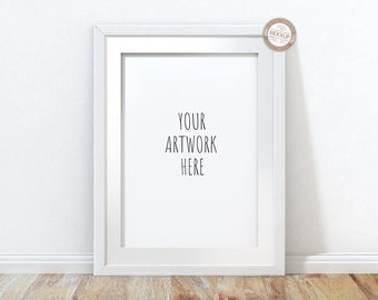 May include: White picture frame mockup with a white mat and a white background. The text "YOUR ARTWORK HERE" is printed in black on the mat.