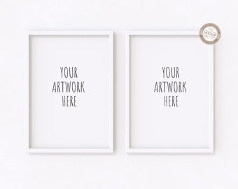 May include: Two white framed art prints with the text "YOUR ARTWORK HERE" in a minimalist style. The frames are rectangular and have a clean, modern design. The background is a plain white surface, creating a clean and simple aesthetic.