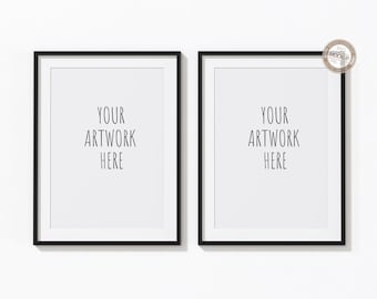 May include: Two black picture frames with white mats and the text "YOUR ARTWORK HERE" in each frame.