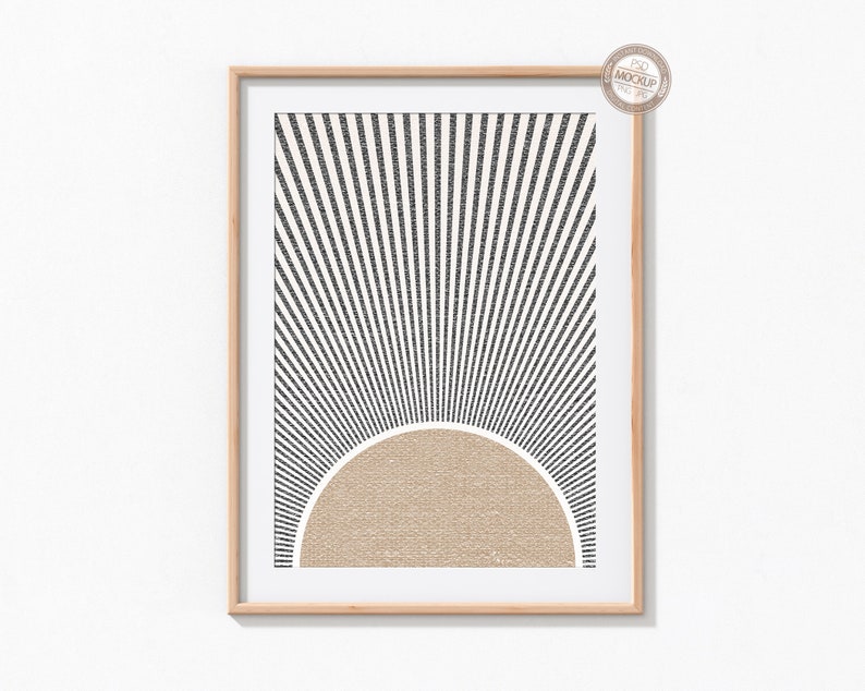 May include: A framed print with a black and white geometric design of radiating lines and a tan half-circle in the center.