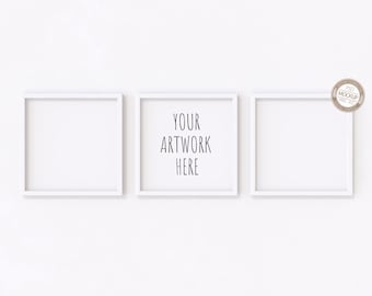 May include: Three white picture frames on a white wall. The center frame has the text "YOUR ARTWORK HERE" inside.