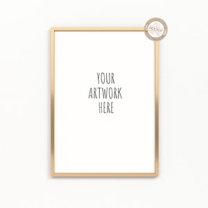 以下が含まれることがあります： 白い背景に金色のフレーム。白い背景に黒い文字で「YOUR ARTWORK HERE」と印刷されています。
