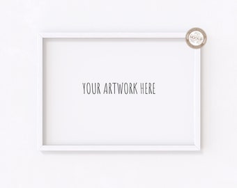 May include: White picture frame with a white mat and a white background. The frame is hanging on a white wall. The text "YOUR ARTWORK HERE" is printed in black inside the frame.