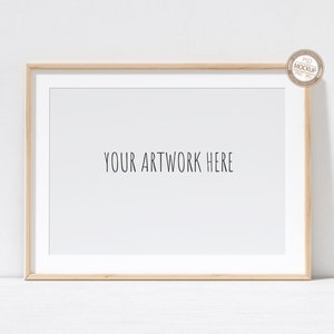 May include: A simple wooden frame with a white mount and a white background. The text "YOUR ARTWORK HERE" is printed in black in the centre of the frame.