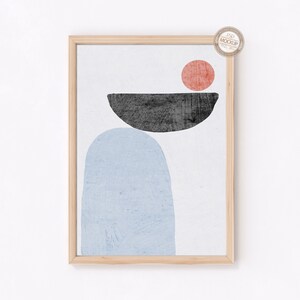 May include: Abstract art print with a blue, black, and red geometric design. The print is framed in a light wood frame.