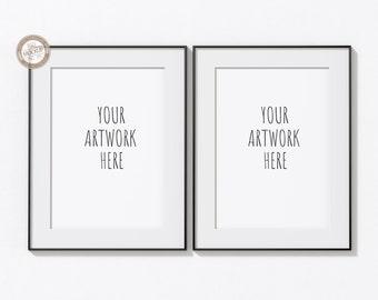 May include: Two black framed picture frames with white mats, each with the text "YOUR ARTWORK HERE" in the center.