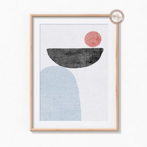 May include: A framed abstract art print with a light blue, dark gray, and red color scheme. The print features a large light blue oval shape, a smaller dark gray oval shape, and a red circle.