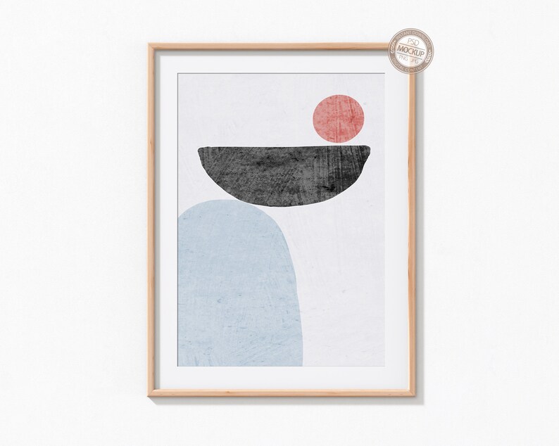 May include: A framed abstract art print with a light blue, dark gray, and red color scheme. The print features a large light blue oval shape, a smaller dark gray oval shape, and a red circle.