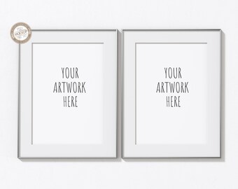 May include: Two silver picture frames with white mats and the text "YOUR ARTWORK HERE" in each frame.