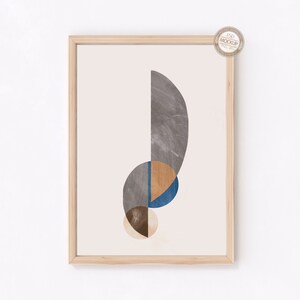 May include: A framed print with an abstract design featuring overlapping circles in shades of gray, blue, brown, and beige.