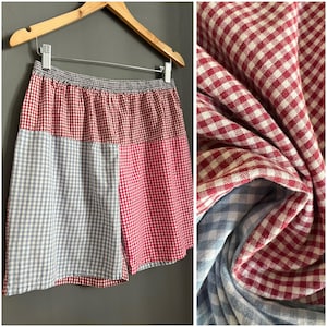 May include: Red and blue checkered shorts with a patchwork design. The shorts are made of a soft, lightweight fabric and have a relaxed fit.