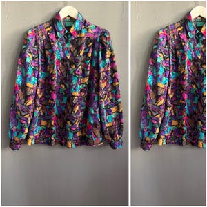 Vintage 1980’s Psychedelic Pattern Blouse Purple Blue Pink Brown Yellow Polyester Statement Shoulders Ladies Shirt Size M-L