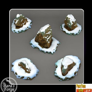 May include: Five miniature snow-covered rock formations with intricate carvings. The rocks are brown with green accents and are set on a gray background.