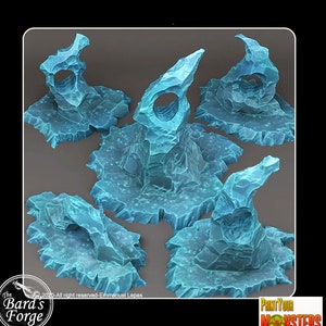 May include: Five blue, icy, rock formations with a jagged, rough texture. The formations are on a white background.