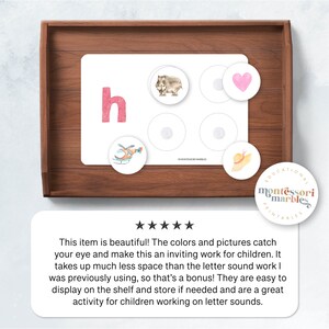 May include: A printable Montessori learning activity for children featuring the letter 'h' in pink with a helicopter, a hippopotamus, a heart, and a hat. The text 'Montessori Marbles' is printed on the card.