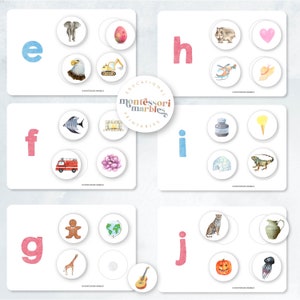 May include: Educational Montessori Marbles printable cards featuring the letters e, f, g, h, i, and j. Each card has a letter and a set of four images, one of which starts with the letter shown. The images include an elephant, an egg, an eagle, a digger, a fish, a fireplace, a fire engine, a flower, a bottle, an ice cream cone, an igloo, a lizard, a gingerbread man, a globe, a giraffe, a guitar, a cheetah, a pitcher, a pumpkin, and a jellyfish.
