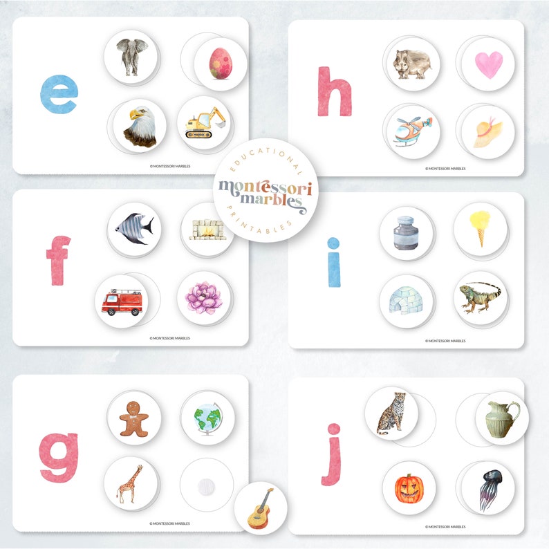 May include: Educational Montessori Marbles printable cards featuring the letters e, f, g, h, i, and j. Each card has a letter and a set of four images, one of which starts with the letter shown. The images include an elephant, an egg, an eagle, a digger, a fish, a fireplace, a fire engine, a flower, a bottle, an ice cream cone, an igloo, a lizard, a gingerbread man, a globe, a giraffe, a guitar, a cheetah, a pitcher, a pumpkin, and a jellyfish.