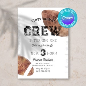 Op de afbeelding: Een voetbalthema eerste verjaardagsinvitation met een bruine en witte voetbalafbeelding en de tekst "First Down! Crew is turning one! Join us for kickoff! Nov. 3 1-3PM Connor Stadium 881 Wild Rose Ct Independence, OR 97351 rsvp to ally at 123.456.7890"