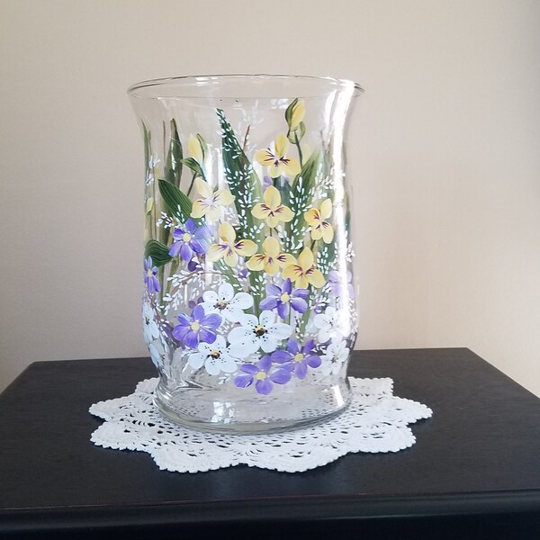 Large glass hurricane style vase.  Hand painted.  Yellow, purple and white garden flowers.