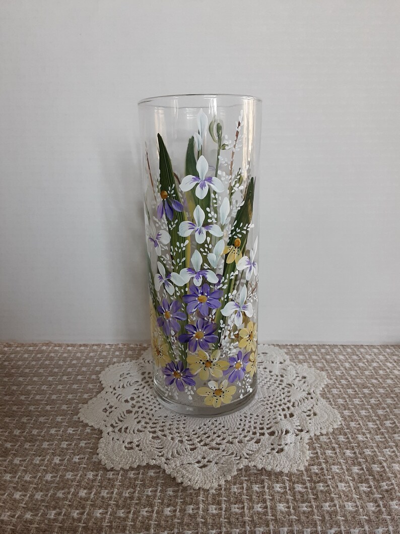 white and yellow flowers painted on front and back. Hand painted glass