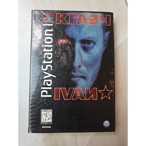 May include: PlayStation game case for "KGAZH IVAN". The cover features a blue-toned portrait of a man and the game title in orange and white. The PlayStation logo and rating information are also visible.