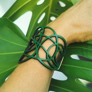 Women's laser cut Leather Bracelet with graceful intertwined lines, ajustable, elegant easy to use magnetic clasp