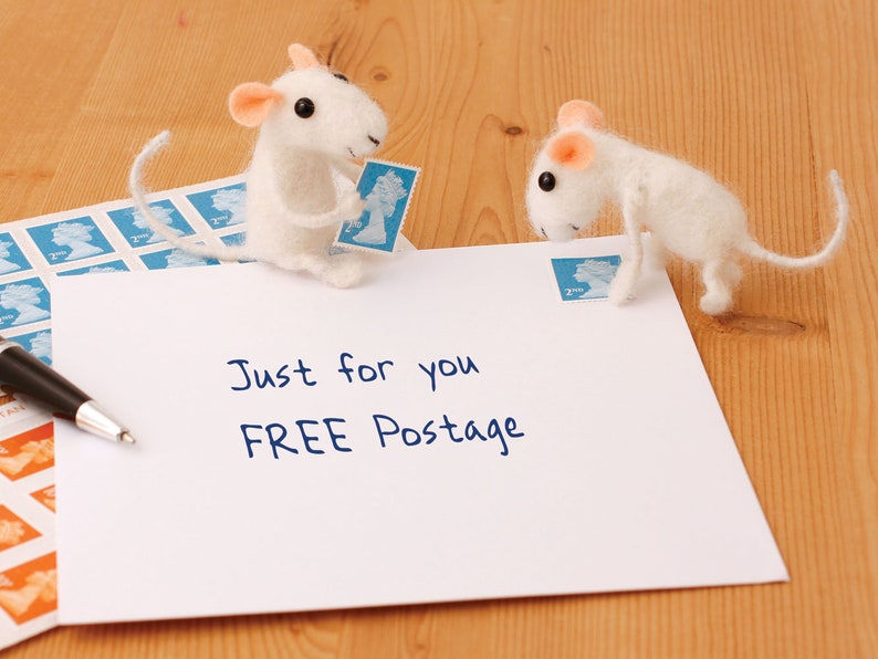 May include: Two white felt mice holding postage stamps on a white envelope with the text "Just for you FREE Postage".