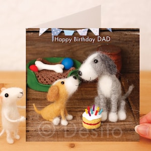 May include: A birthday card featuring two felt dogs, one gray and one brown, with a birthday cake and the text "Happy Birthday DAD".