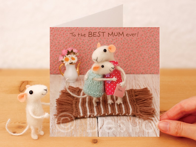 May include: A greeting card with a felt mouse illustration. The card features two mice hugging and the text "To the BEST MUM ever!"