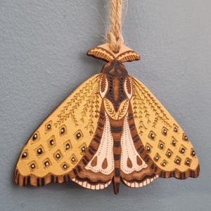 Folk art Moth, hand-drawn, laser-etched and cut from wood