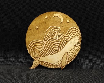 Whale and the moon, hand-drawn, laser-etched and laser-cut into wood