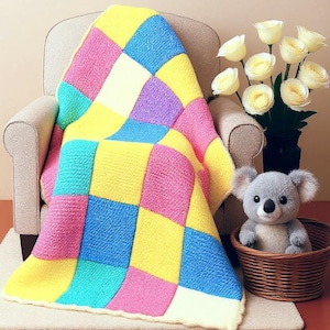 May include: A vibrant, patchwork blanket in shades of yellow, blue, pink, purple, and white, draped over a beige armchair. A koala soft toy sits in a wicker basket, beside a vase of white roses.