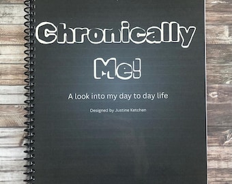 May include: A black spiral-bound notebook with the title "Chronically Me!" in white, along with the subtitle "A look into my day to day life." The notebook is designed by Justine Ketchen.