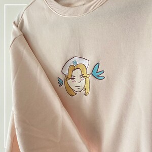 Overwatch HEROES NEVER DIE! Mercy Sweater