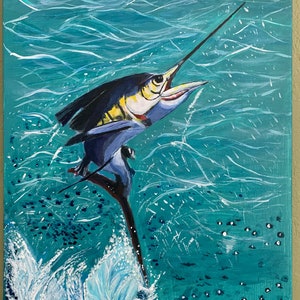 May include: Acrylic painting of a marlin leaping from turquoise water. The fish is depicted in shades of blue, yellow, and white, with its long bill pointed upwards. White water splashes around the fish, and small white dots represent bubbles.