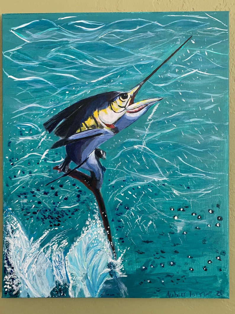 May include: Acrylic painting of a marlin leaping from turquoise water. The fish is depicted in shades of blue, yellow, and white, with its long bill pointed upwards. White water splashes around the fish, and small white dots represent bubbles.