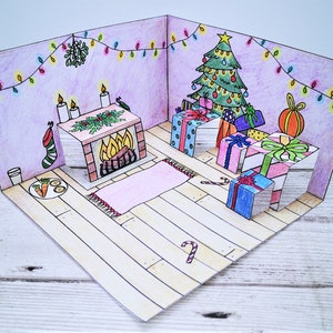 Manualidad navideña emergente imprimible para niños, con chimenea, árbol de Navidad y regalos de Navidad