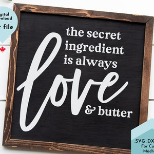 May include: A black framed sign with white text that reads "the secret ingredient is always love & butter". The sign is on a white wood background.  .SVG .DXF .PNG For Cutting Machines