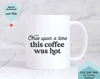 May include: White ceramic coffee mug with black text that reads "Once upon a time this coffee was hot".
