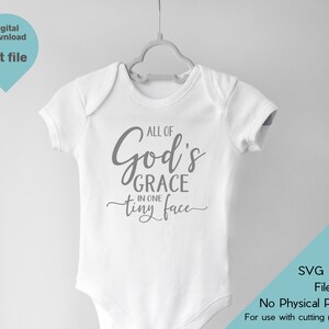 May include: White baby onesie with the text "All of God's Grace in one tiny face" in gray lettering.