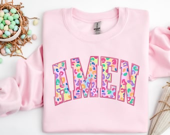 May include: Pink sweatshirt with the word "AMEN" in rainbow leopard print letters.