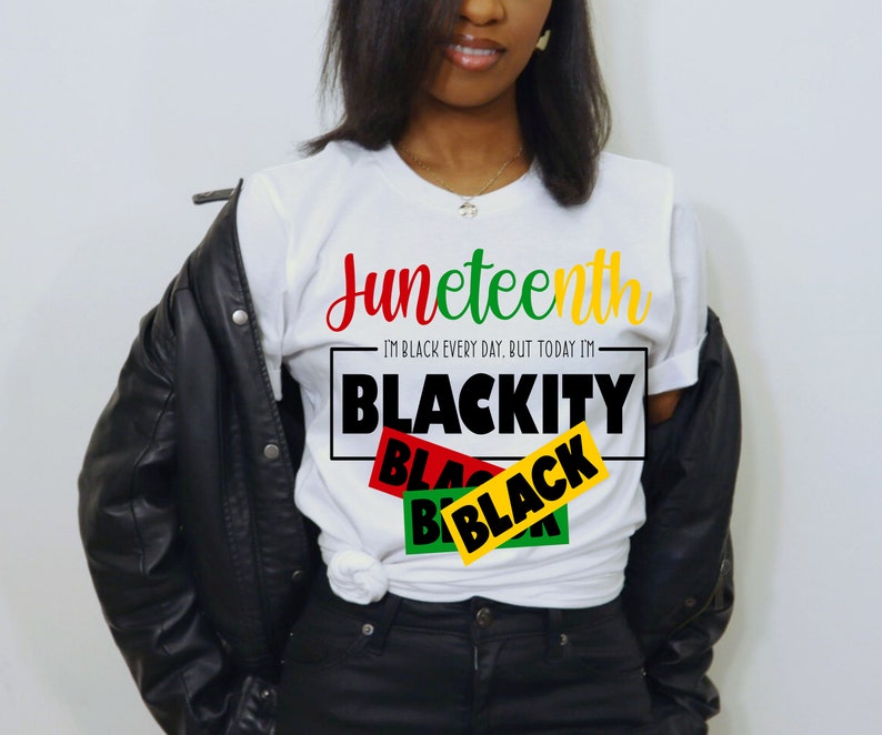 May include: White t-shirt with the text "Juneteenth" in red, green, and yellow lettering. Below the text is a black rectangle with the text "I'm Black Every Day, But Today I'm Blackity" in white lettering. Overlapping the rectangle are three black rectangles with the word "Black" in red, green, and yellow lettering.