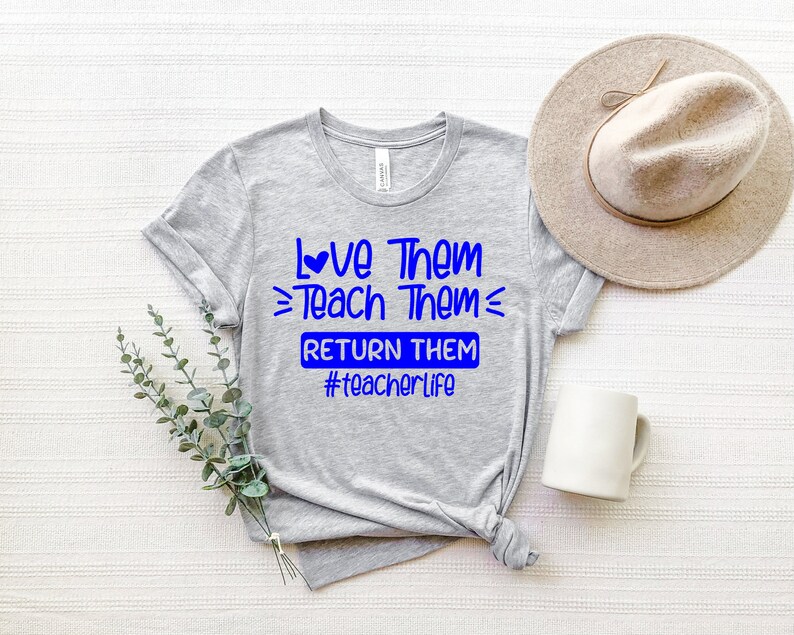 May include: Gray t-shirt with blue text that reads "Love Them Teach Them Return Them #teacherlife".